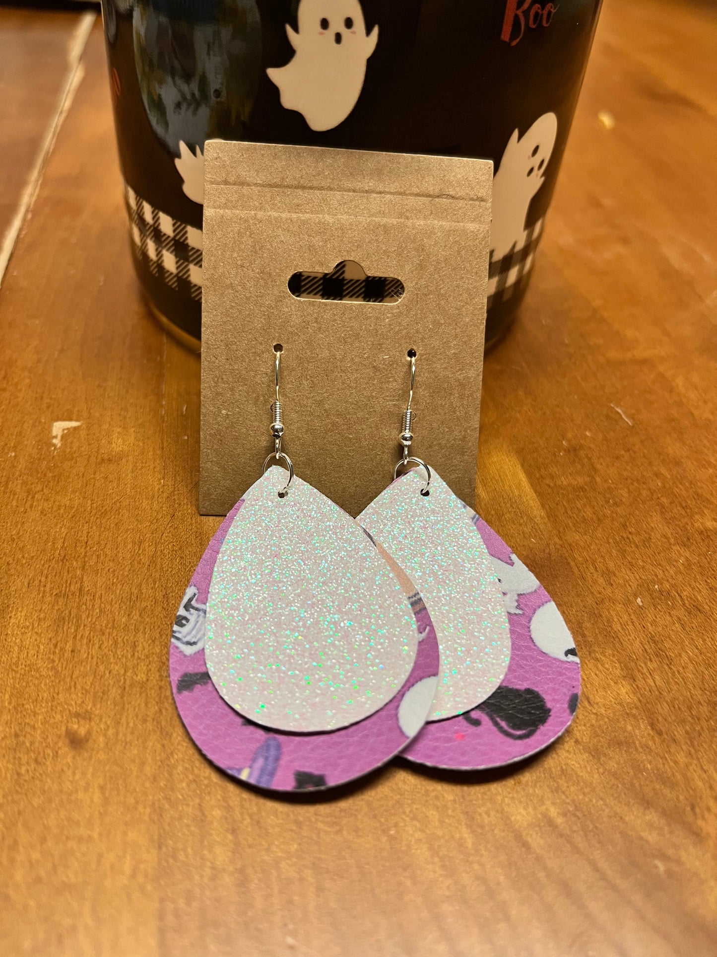 Purple background with ghosts, white glitter Earrings