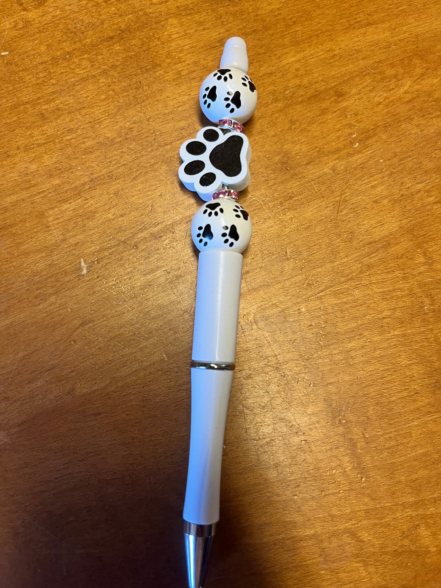 Pen - White with black paw print beads