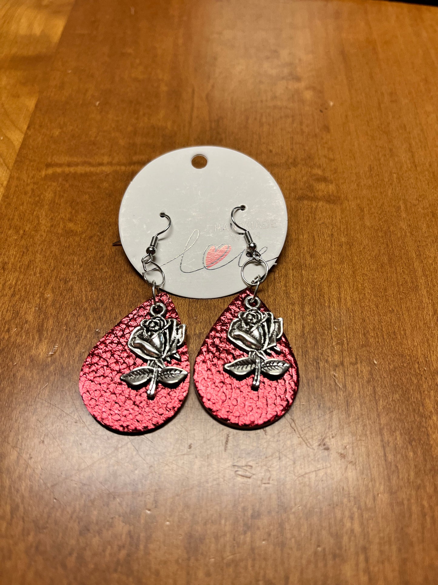 Red faux leather earrings with rose charm